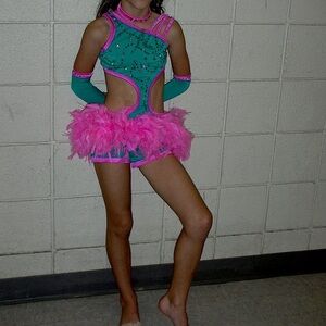 Custom dance costume with Swarovski Crystals.  Teal and pink with arm sleeves